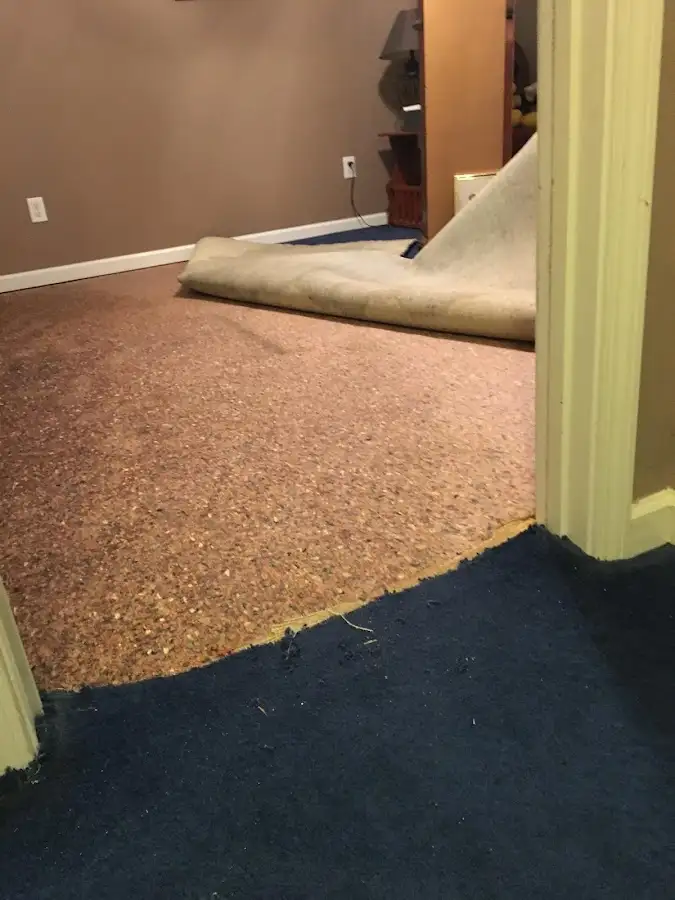 Carpet pad removal revealing water damage during Drying & Dehumidification in El Reno